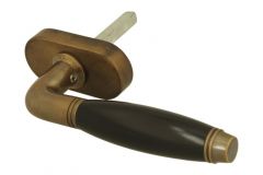Poignée (1929) laiton patiné bois d'ébène