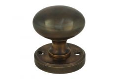 Bouton tournant rond laiton patiné sur rosace ronde