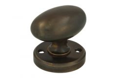 Bouton tournant ovale laiton patiné sur rosace ronde