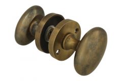 Bouton de porte ovale laiton patiné avec rosace ronde