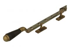 Entrebailleur de fenêtre laiton patiné bois d'ébène (1908)