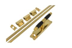 Crémone en applique laiton poli bois d'ébène (1928)