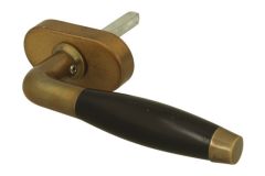 Poignée (1932) laiton patiné bois d'ébène