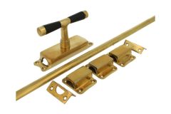 Crémone en applique pour fenêtre laiton poli (1918)