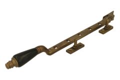 Entrebailleur de fenêtre ornementé laiton patiné bakélite